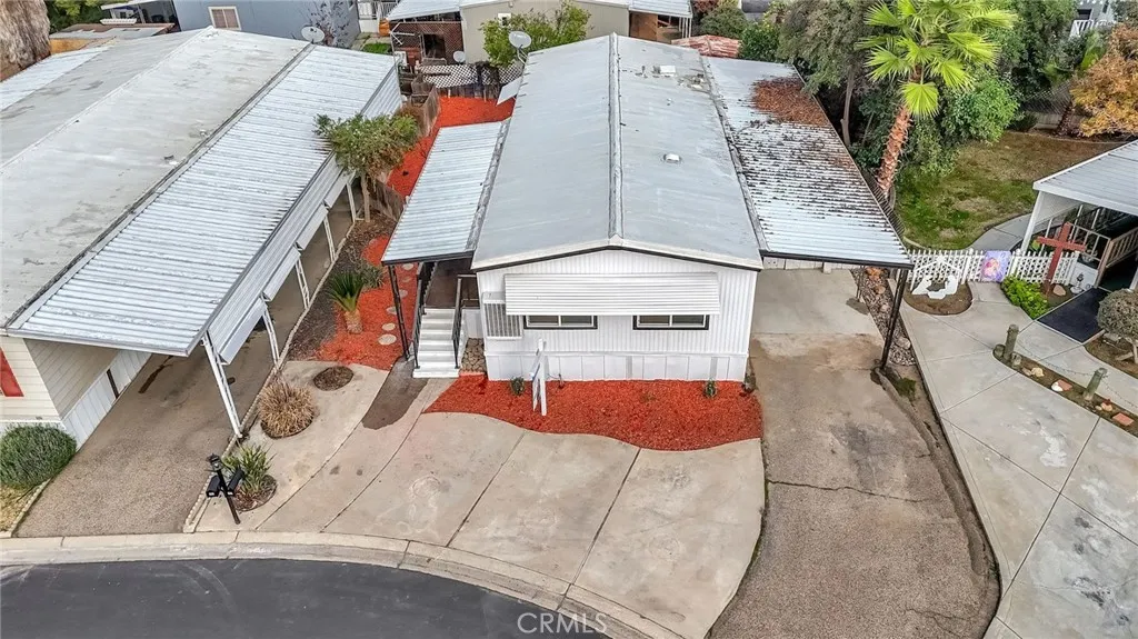 1218 East Cleveland Avenue, Unit 153 Madera, CA 93638 - Photo 31 of 39 an aerial view of a house with a yard and seating area