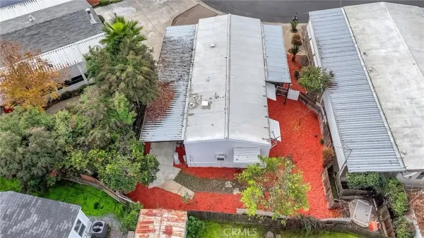 an aerial view of a houses with a yard