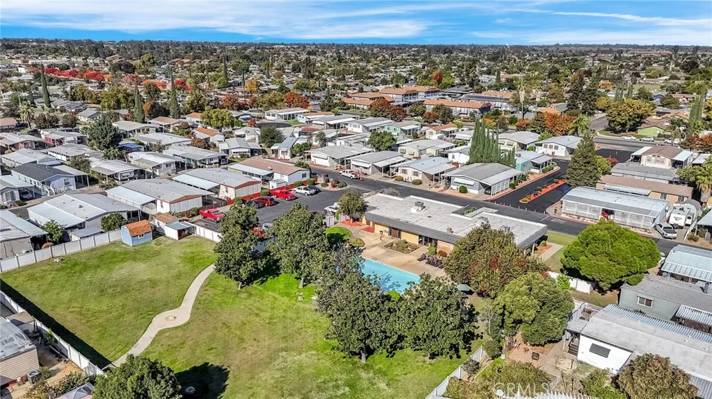 1218 East Cleveland Avenue, Unit 153 Madera, CA 93638 - Photo 36 of 39 an aerial view of residential houses with outdoor space