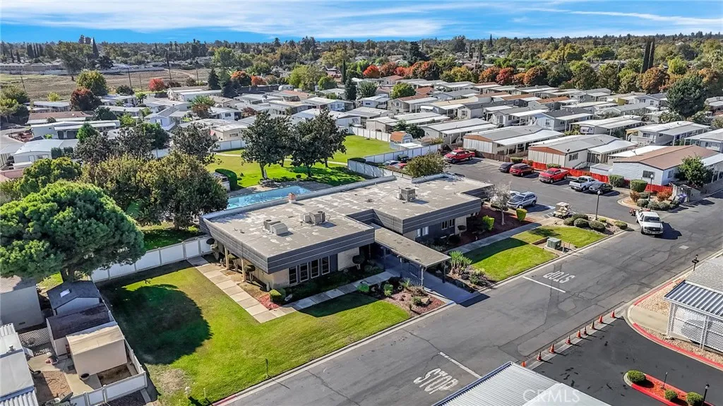 1218 East Cleveland Avenue, Unit 153 Madera, CA 93638 - Photo 38 of 39 an aerial view of a house with a garden