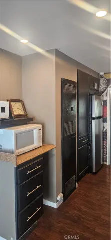 a kitchen with a refrigerator and cabinets