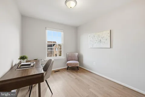 a workspace with furniture and window