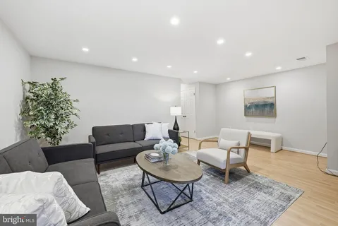 a living room with furniture and a rug