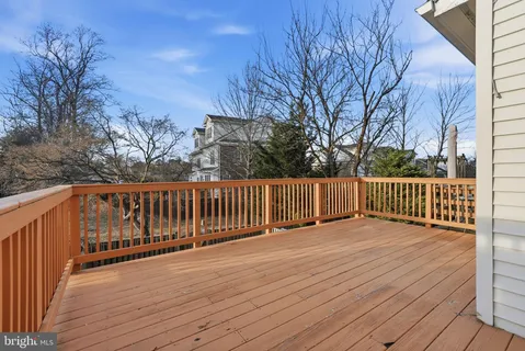 a view of deck with wooden floor and fence