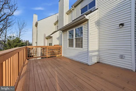 a view of a house with wooden deck