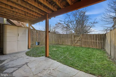 a view of a house with backyard and porch