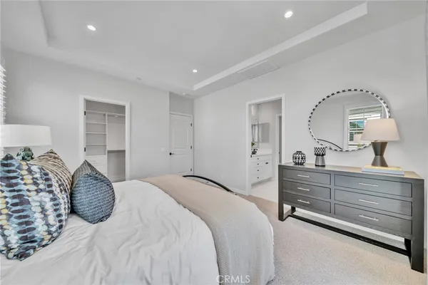 a bedroom with double bed and a window