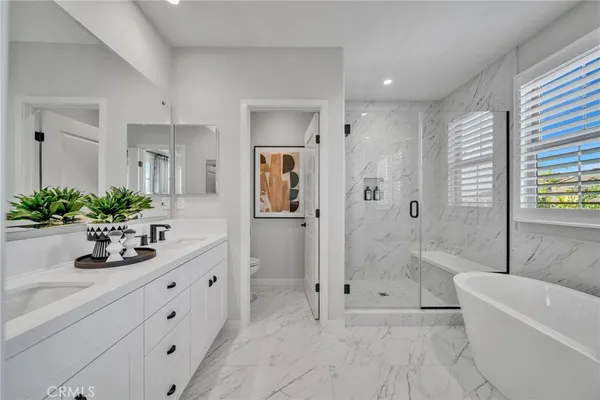 a bathroom with a bathtub and a shower