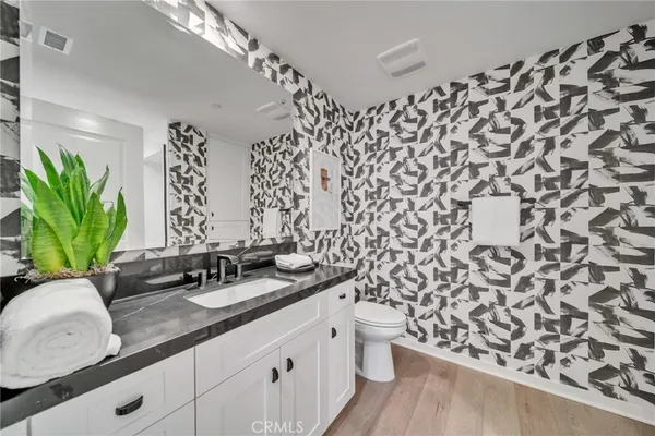 a bathroom with a double vanity sink and mirror