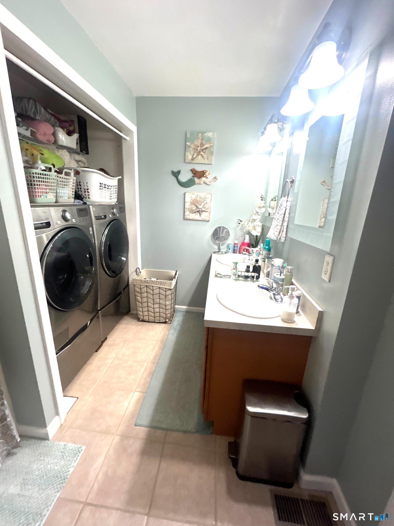 194 Summit Street Norwich, CT 06360 - Photo 16 of 24 a utility room with sink dryer and washer