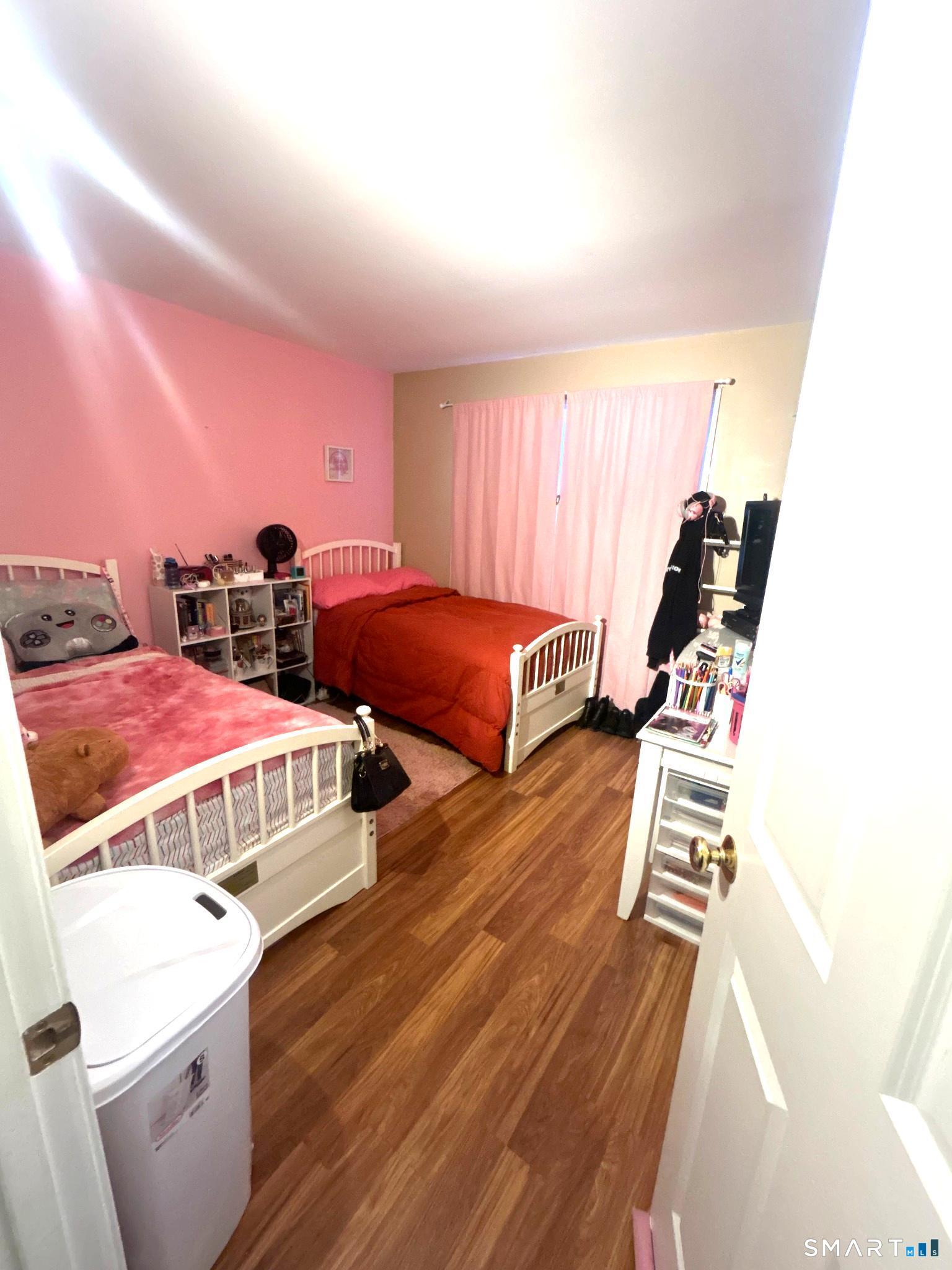 194 Summit Street Norwich, CT 06360 - Photo 17 of 24 a bedroom with two beds and a window