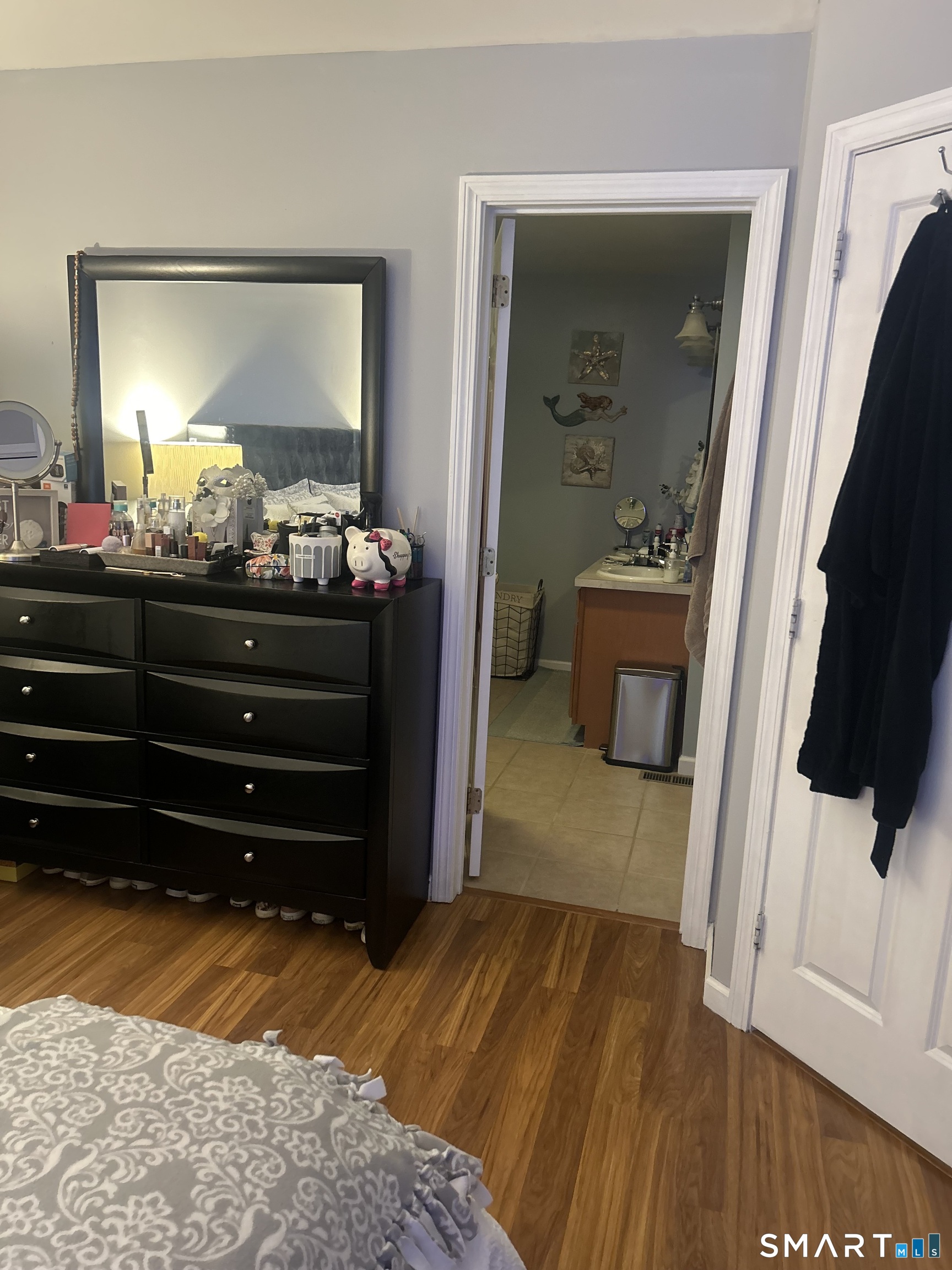 194 Summit Street Norwich, CT 06360 - Photo 19 of 24 a bedroom with a bed and a mirror on dresser