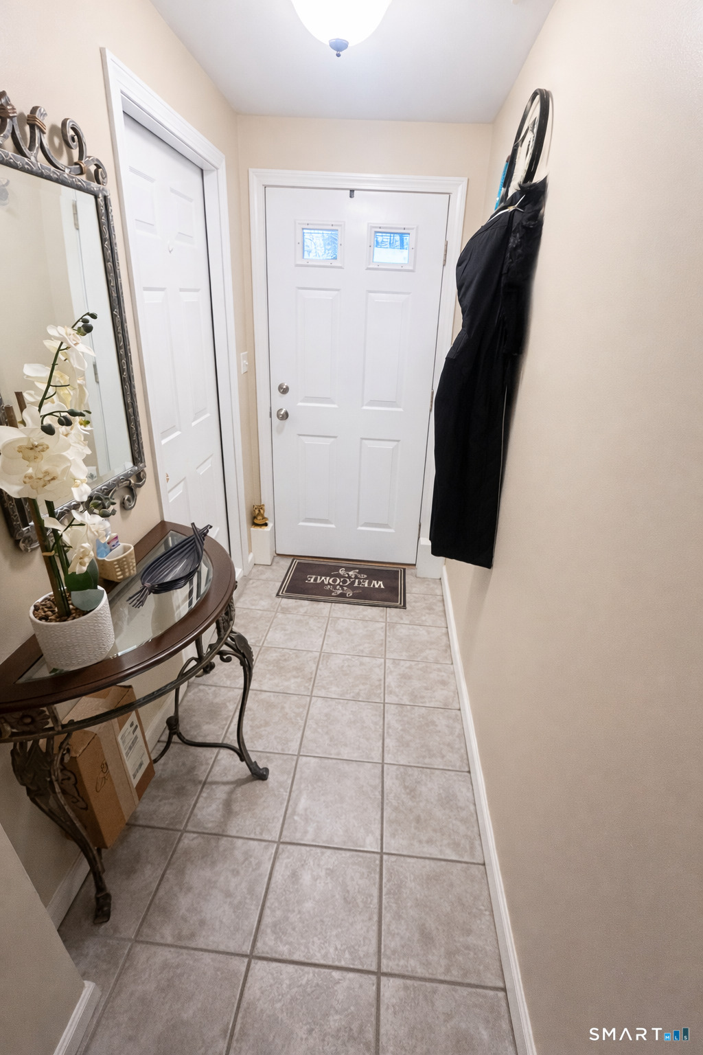 194 Summit Street Norwich, CT 06360 - Photo 21 of 24 a view of a hallway with wooden floor and white cabinet