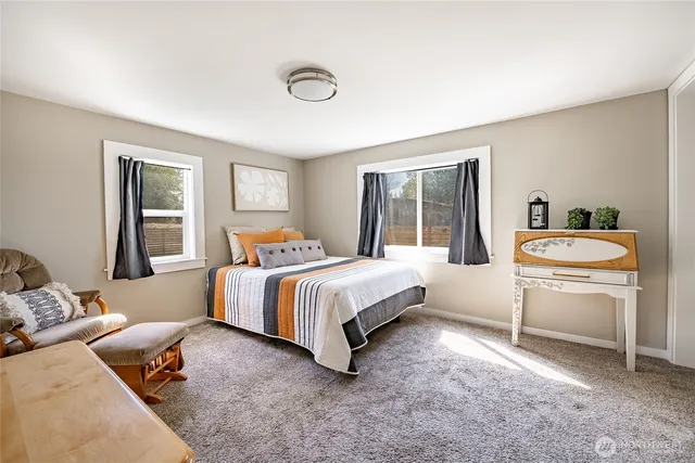 a bed room with a bed and a couch