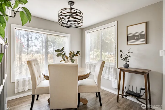 a view of a dining room with furniture window and wooden floor