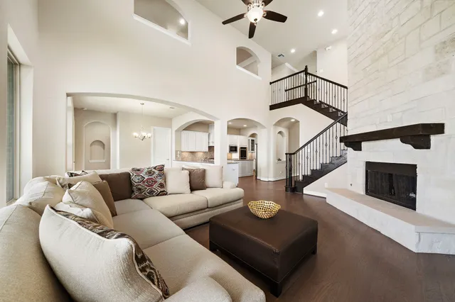 a living room with furniture and a fireplace