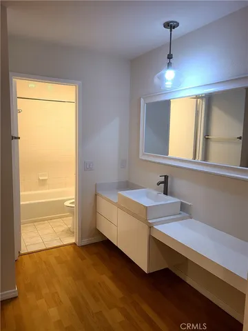 a spacious bathroom with a bathtub and a sink