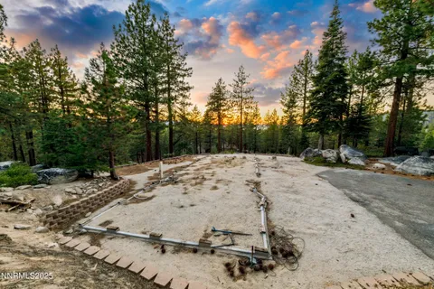 a view of a yard covered with snow in the background