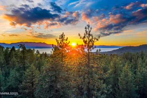 a view of a houses with a lake in the background