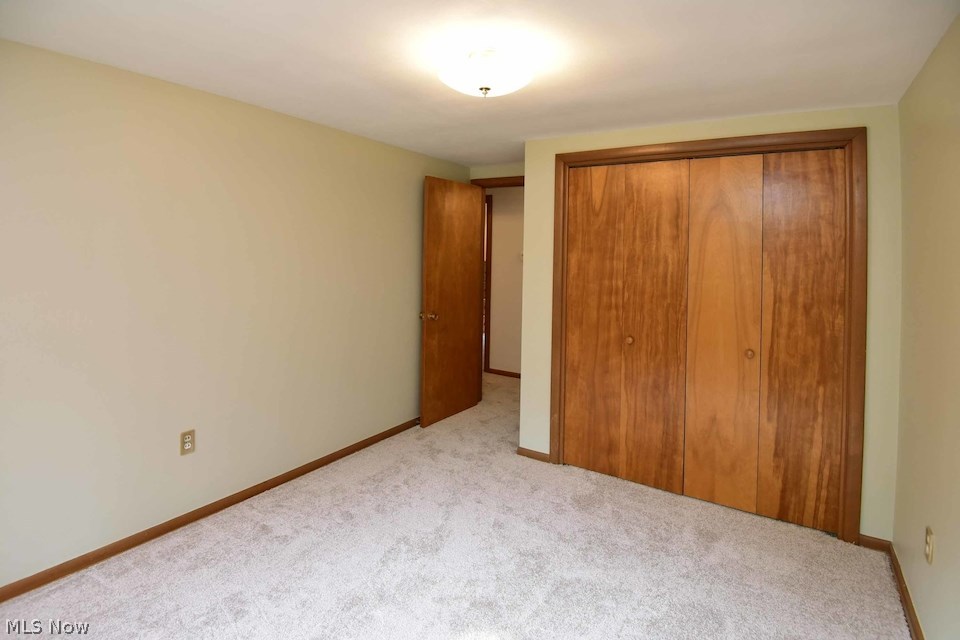 295 River Road Hinckley, OH 44233 - Photo 17 of 25 One of four bedrooms with new carpeting, double closet and built in storage. All bedrooms are freshly carpeted and painted.