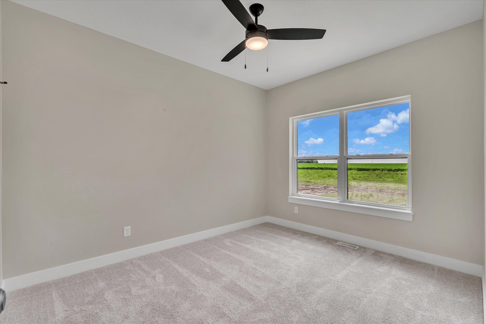 455 Rhonda Road New Liberty, IA 52765 - Photo 39 of 54 an empty room with a window