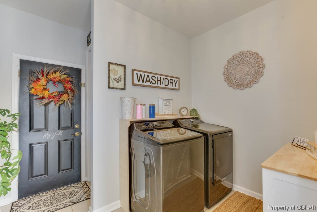 4 Willow Road Hampton, VA 23664 - Photo 43 of 48 Clothes washing area with washing machine and clothes dryer and light wood-type flooring