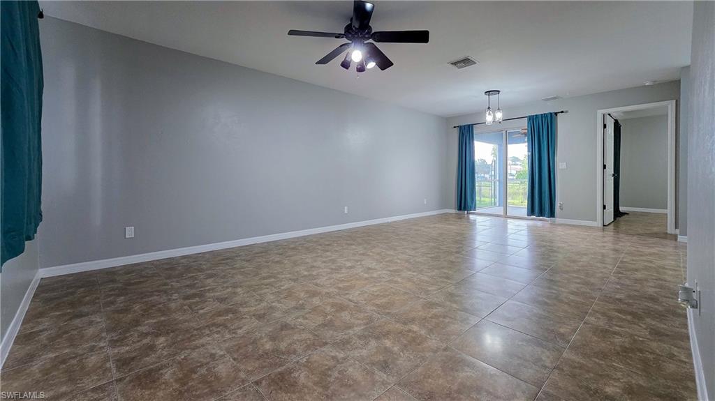 7319 Albany Road Fort Myers, FL 33967 - Photo 4 of 27 an empty room with fan and windows