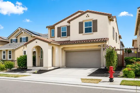 a front view of a house with garage