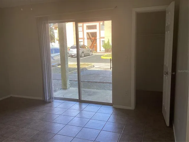 a view of an empty room and window