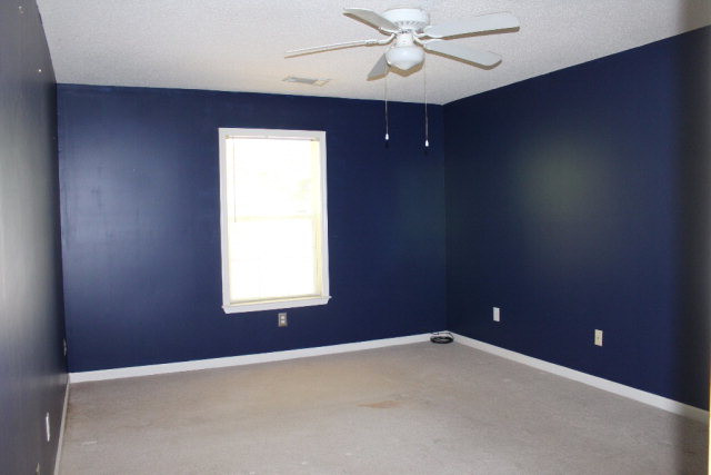 112 Single Tree Lane Aiken, SC 29803 - Photo 5 of 11 an empty room with a window and a fan