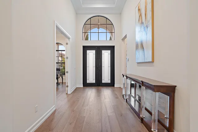 a view of a bathroom with a tub shower and mirror