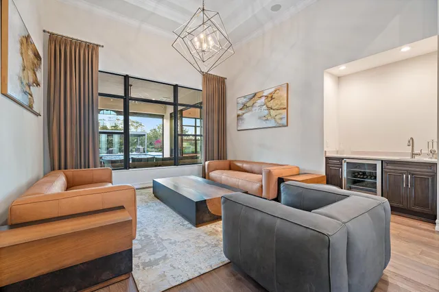a bathroom with a granite countertop sink a large mirror and a shower