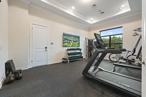 a open kitchen with stainless steel appliances granite countertop a refrigerator and a stove