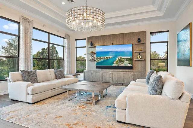 a kitchen with a stove and wooden floor