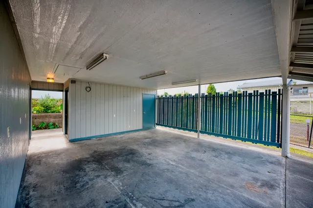 a view of a porch with a table and a chairs