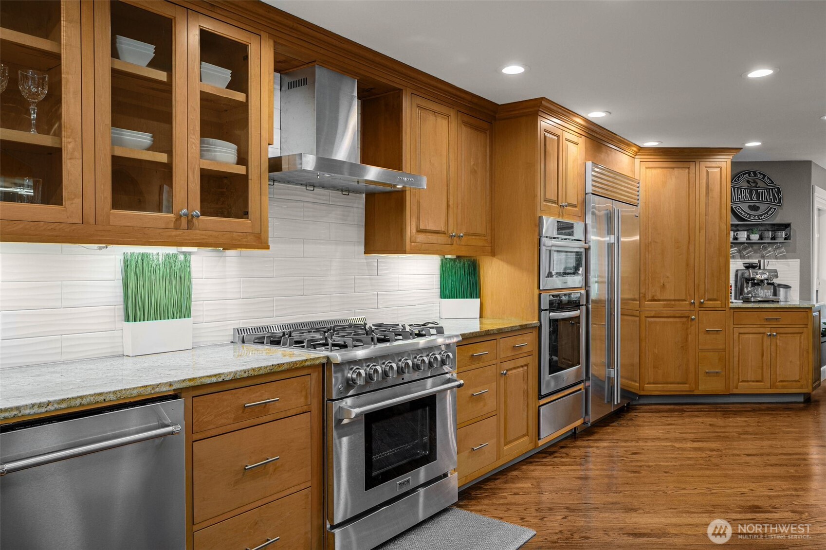 7909 Fern Glen Road Lake Stevens, WA 98258 - Photo 14 of 40 a kitchen with stainless steel appliances granite countertop a stove and a refrigerator