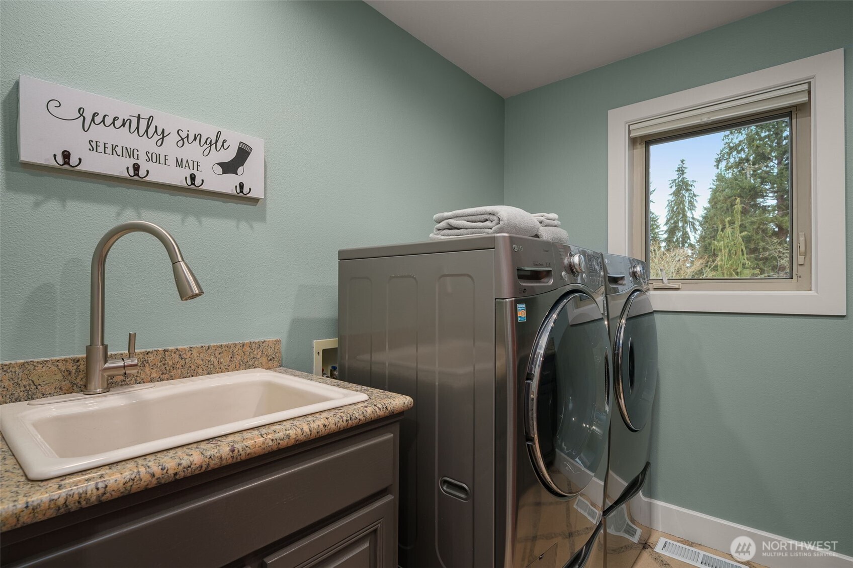 7909 Fern Glen Road Lake Stevens, WA 98258 - Photo 16 of 40 a bathroom with a granite countertop sink and a mirror