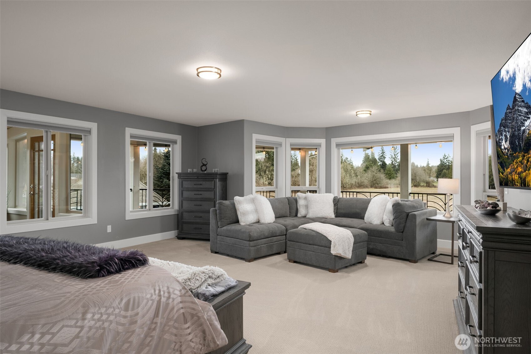 7909 Fern Glen Road Lake Stevens, WA 98258 - Photo 17 of 40 a bedroom with furniture large window and a flat screen tv