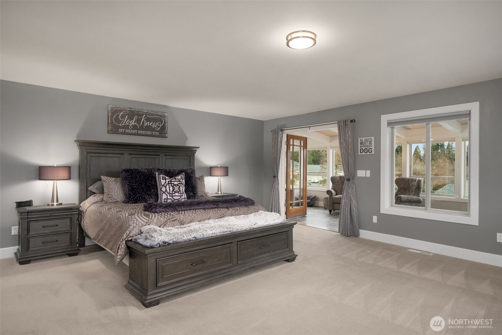 7909 Fern Glen Road Lake Stevens, WA 98258 - Photo 19 of 40 a bedroom with a large bed and a large window
