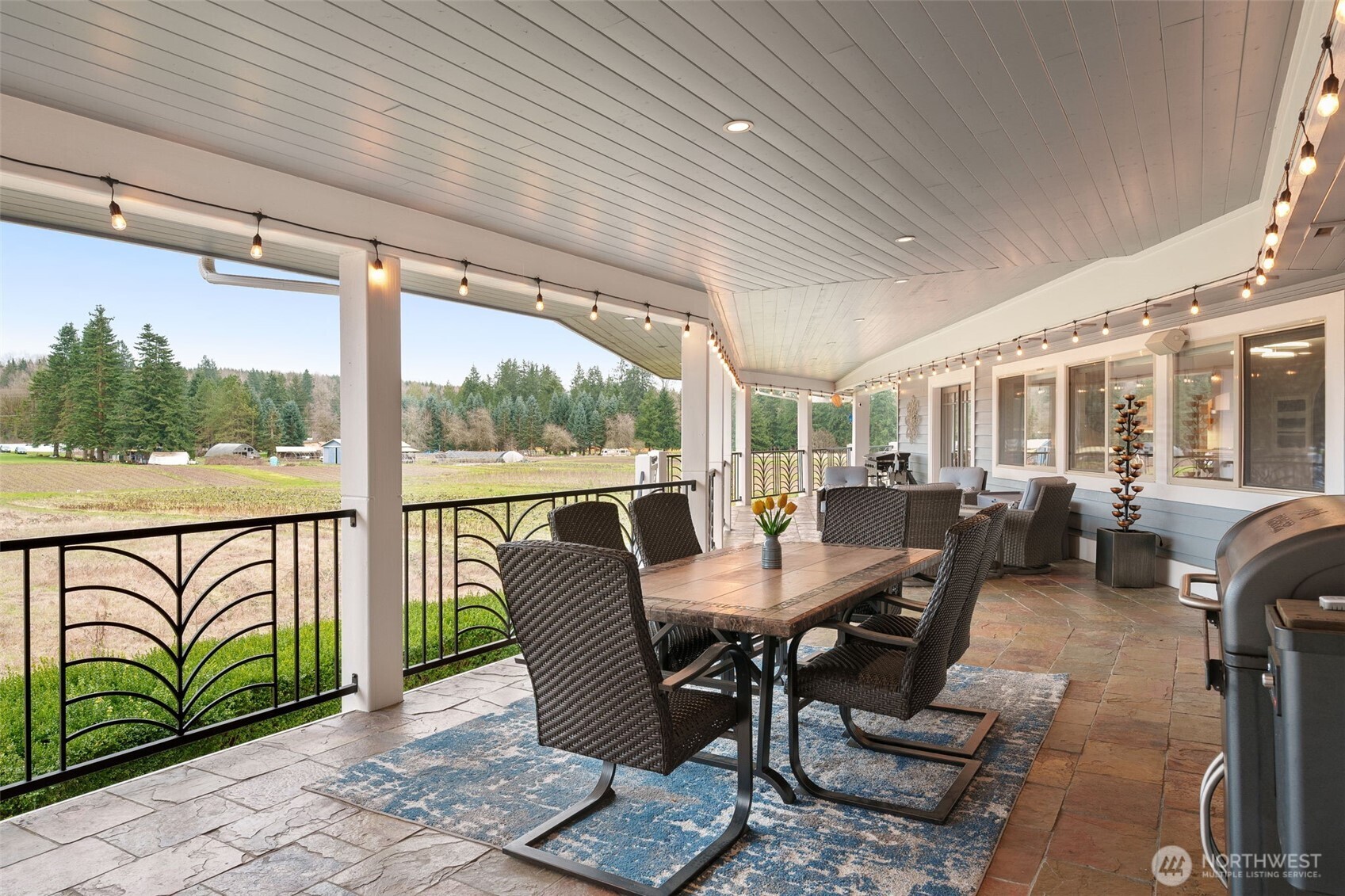 7909 Fern Glen Road Lake Stevens, WA 98258 - Photo 32 of 40 a view of a patio with table and chairs