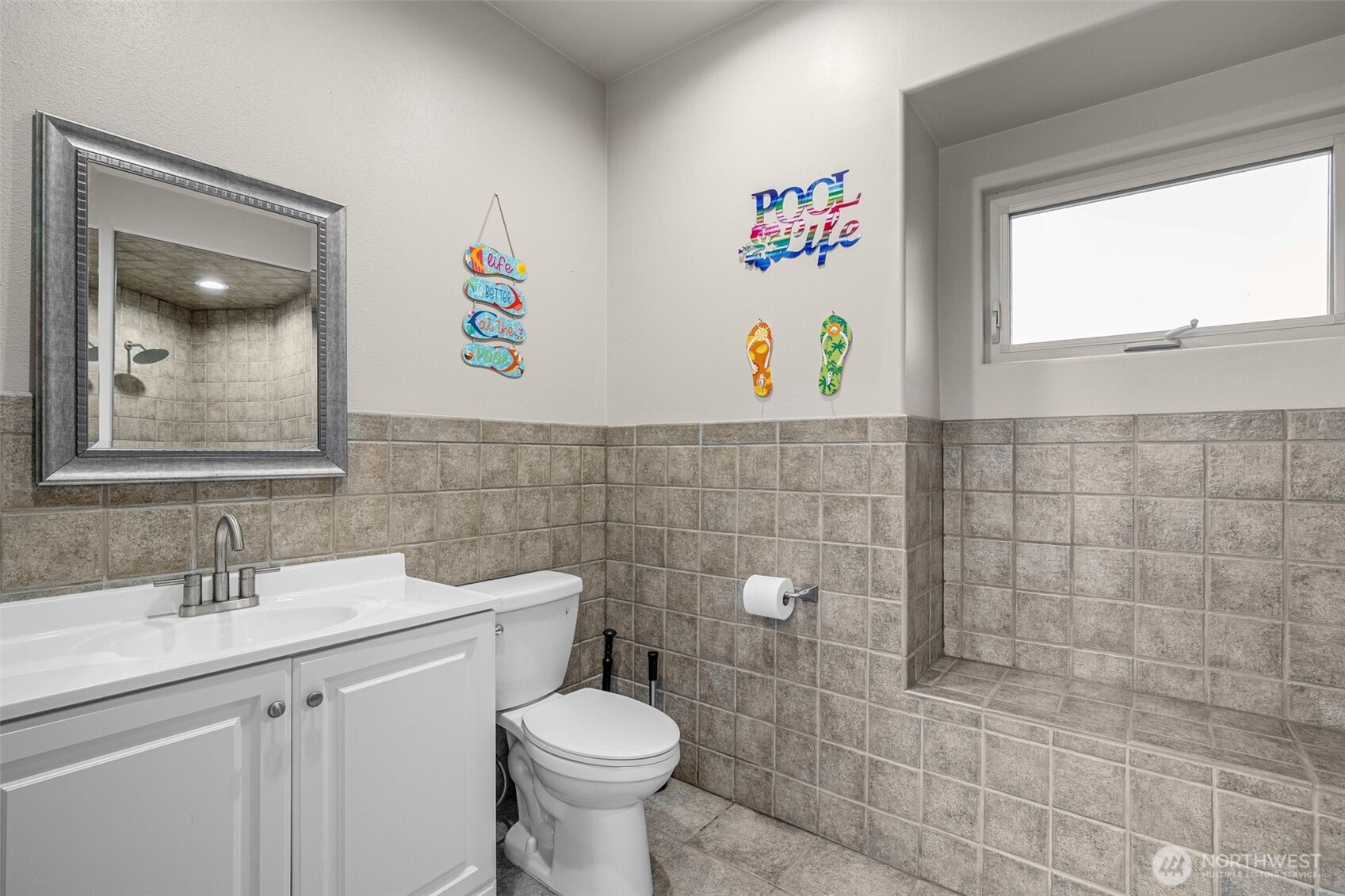 7909 Fern Glen Road Lake Stevens, WA 98258 - Photo 35 of 40 a bathroom with a toilet sink and mirror