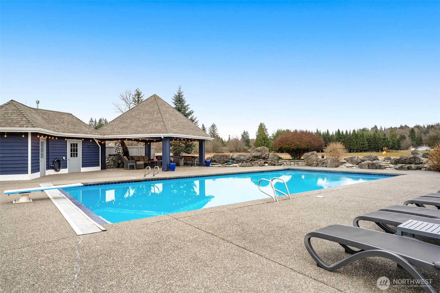 7909 Fern Glen Road Lake Stevens, WA 98258 - Photo 36 of 40 an outdoor space with swimming pool and furniture