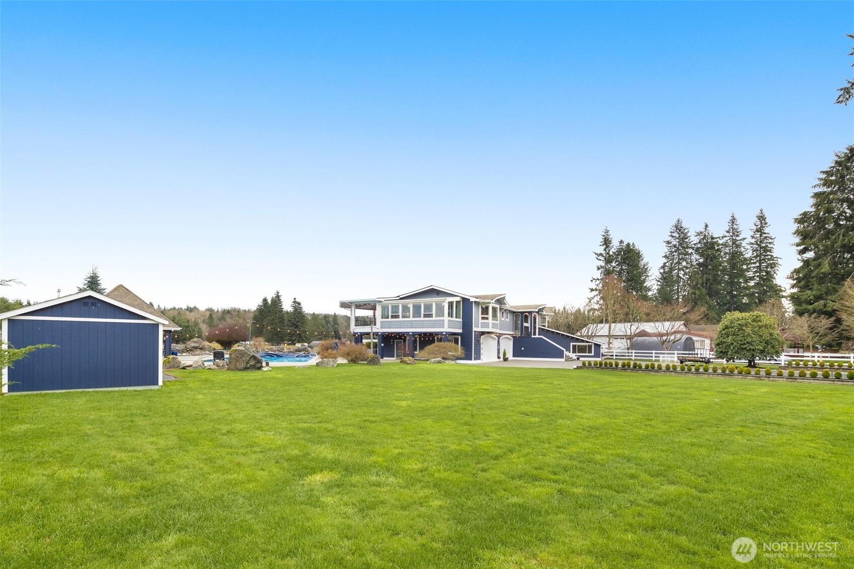7909 Fern Glen Road Lake Stevens, WA 98258 - Photo 37 of 40 a view of a house with a big yard and large trees