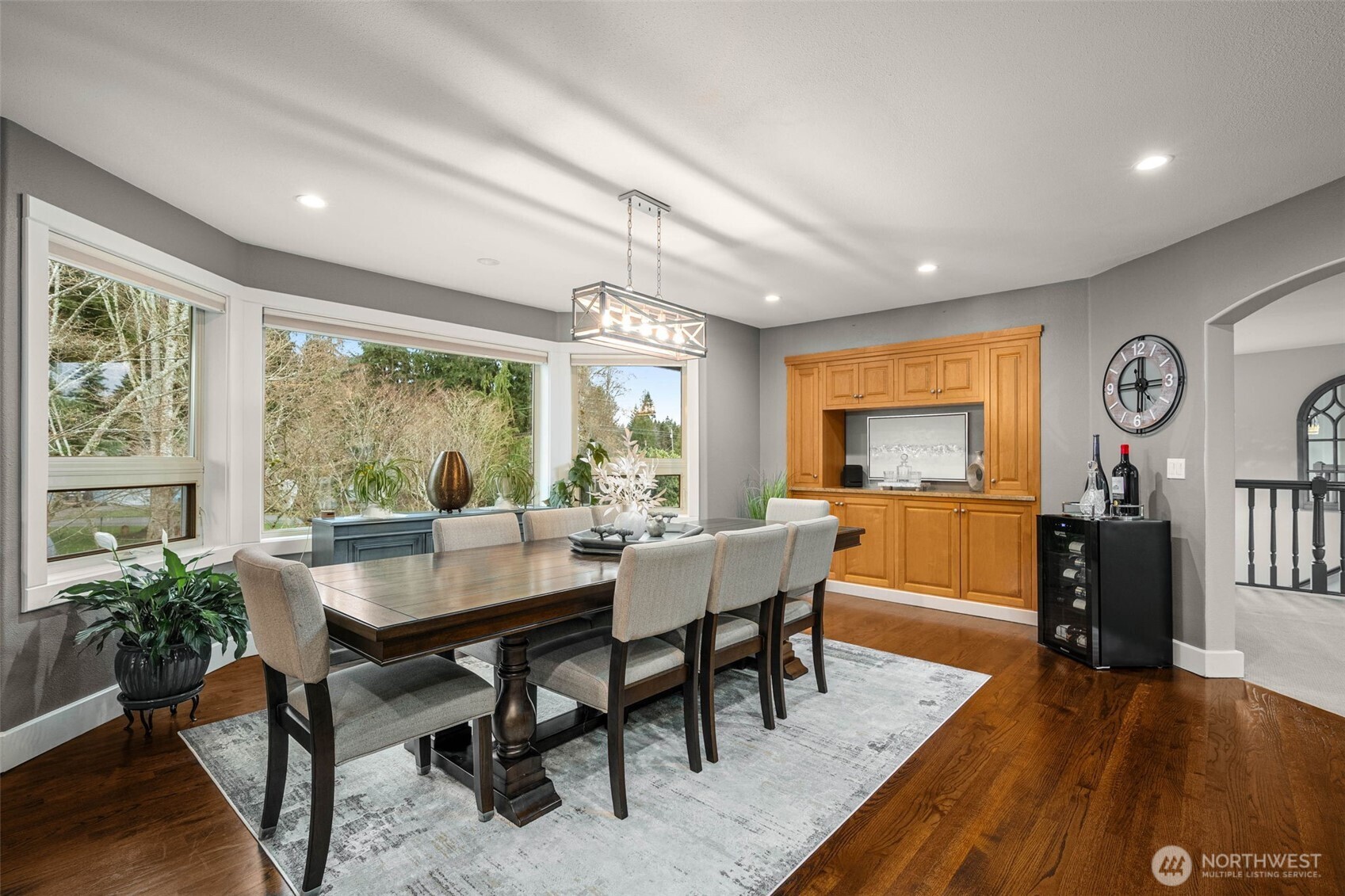 7909 Fern Glen Road Lake Stevens, WA 98258 - Photo 9 of 40 a view of a dining room with furniture window and wooden floor