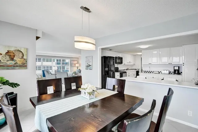a view of washer and dryer with kitchen in the background