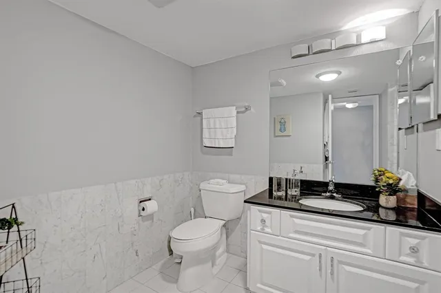 a sign broad in front of flowers