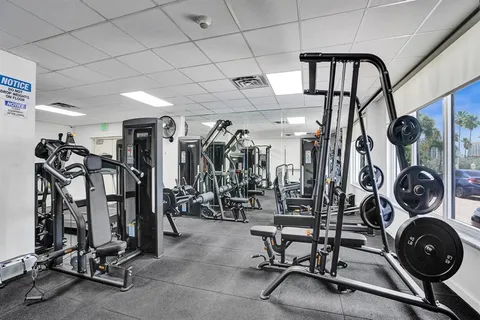 a view of a hallway with furniture