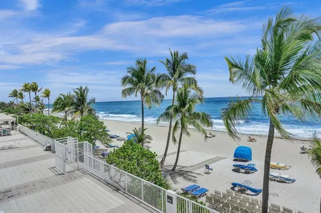 a view of a building with a backyard