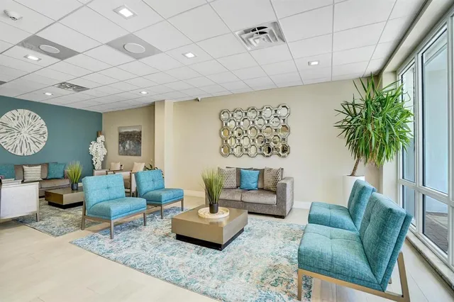 a large kitchen with a table and chairs