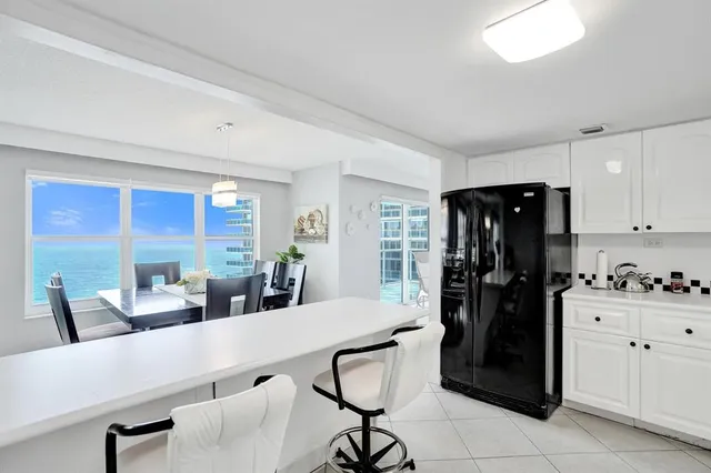 a view of a dining room with furniture window and outside view